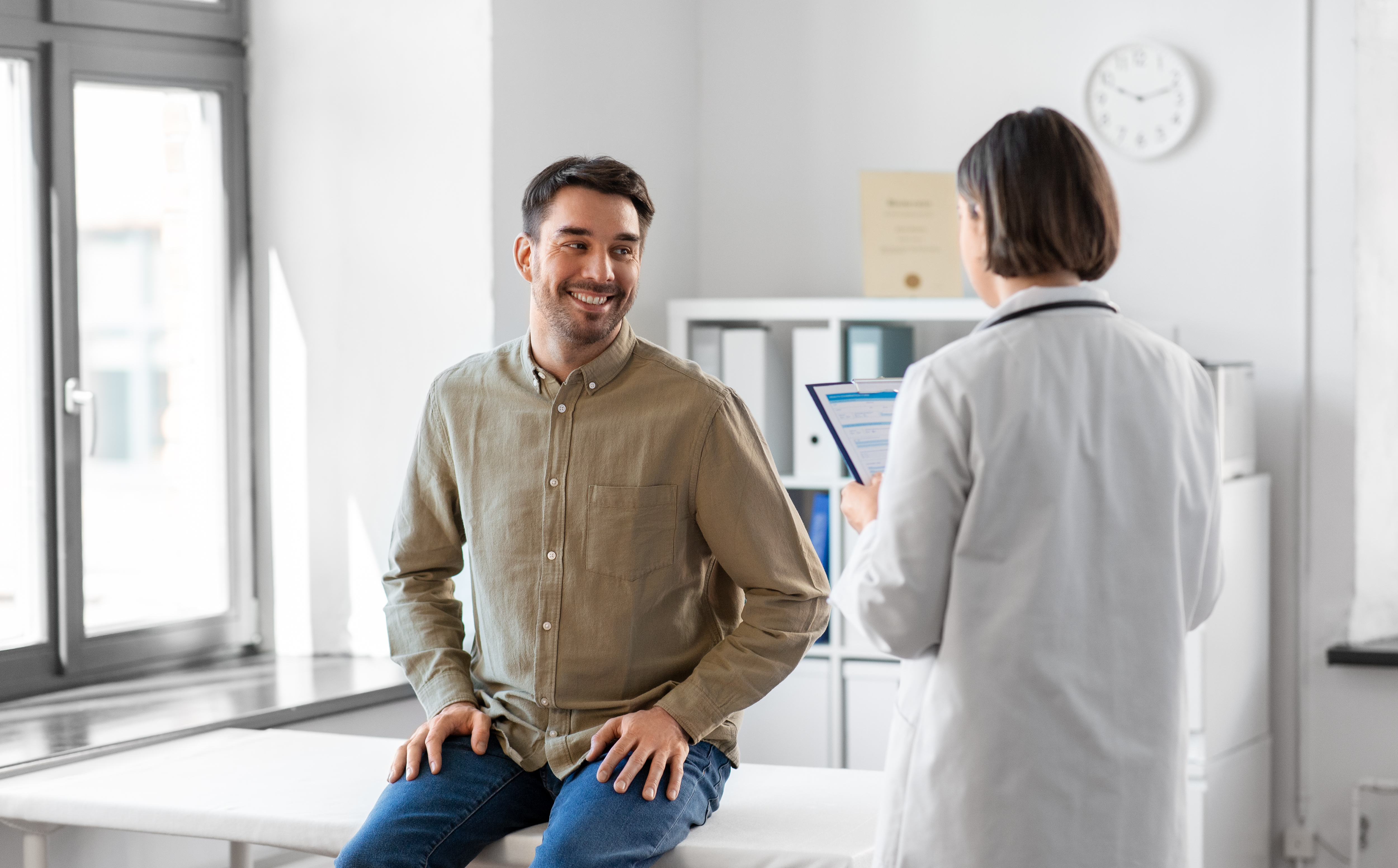 doctor-smiling-man-meeting-hospital.jpg